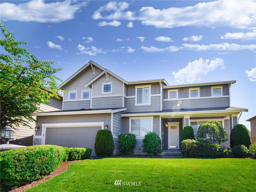 4002 216th Place Southeast Bothell, WA 98021 - Photo 1 of 28 a front view of a house with garden