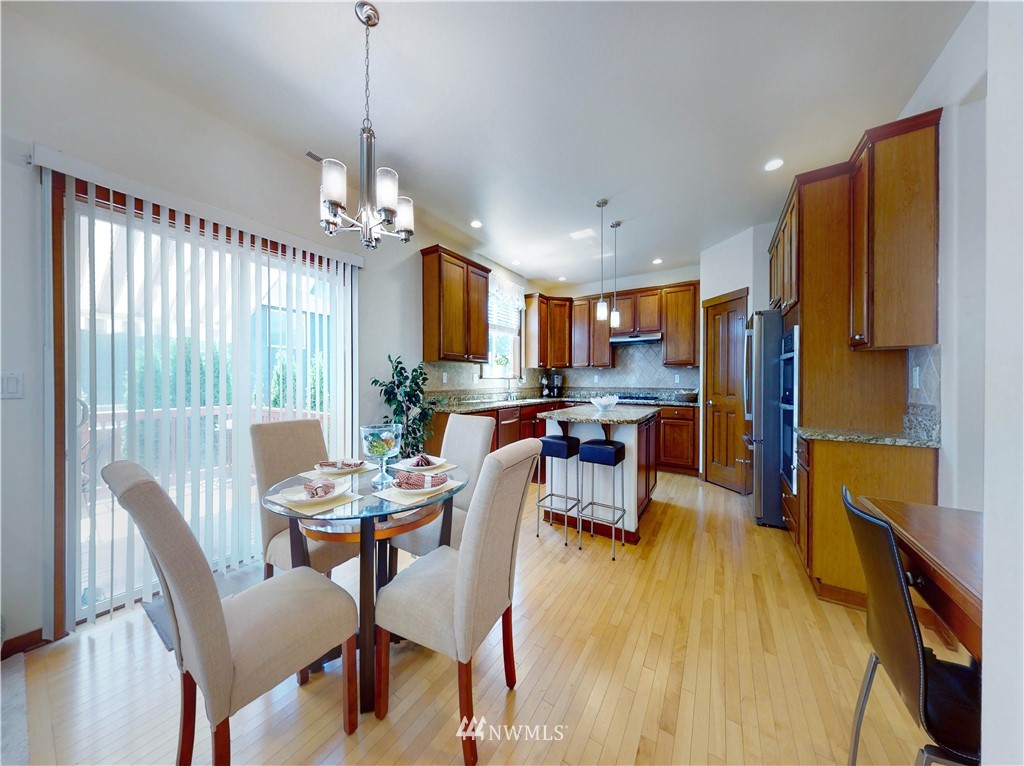4002 216th Place Southeast Bothell, WA 98021 - Photo 11 of 28 a view of a dining room with furniture window and outside view