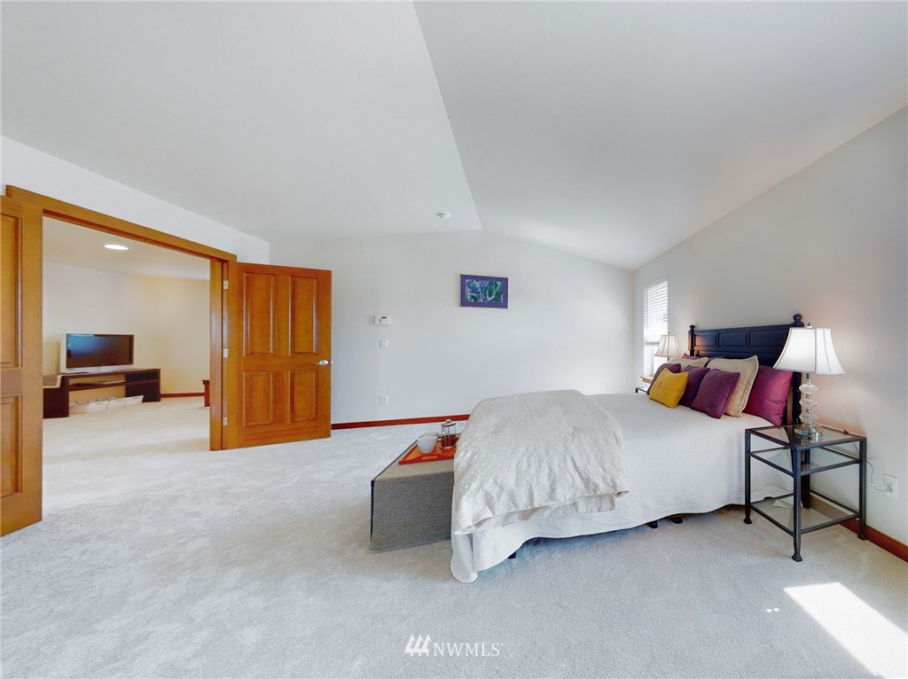 4002 216th Place Southeast Bothell, WA 98021 - Photo 15 of 28 a bedroom with a bed and lamp