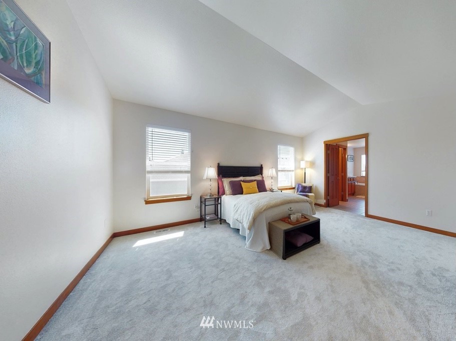 4002 216th Place Southeast Bothell, WA 98021 - Photo 16 of 28 a spacious bedroom with a bed and window