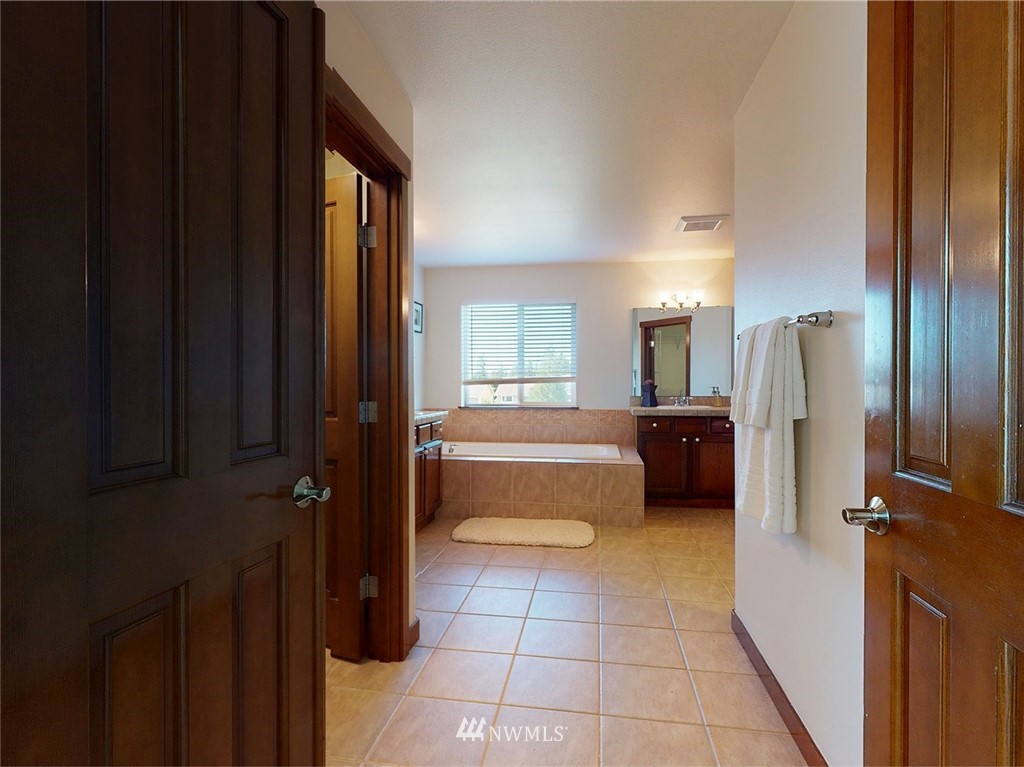 4002 216th Place Southeast Bothell, WA 98021 - Photo 18 of 28 a bathroom with a bathtub and a shower