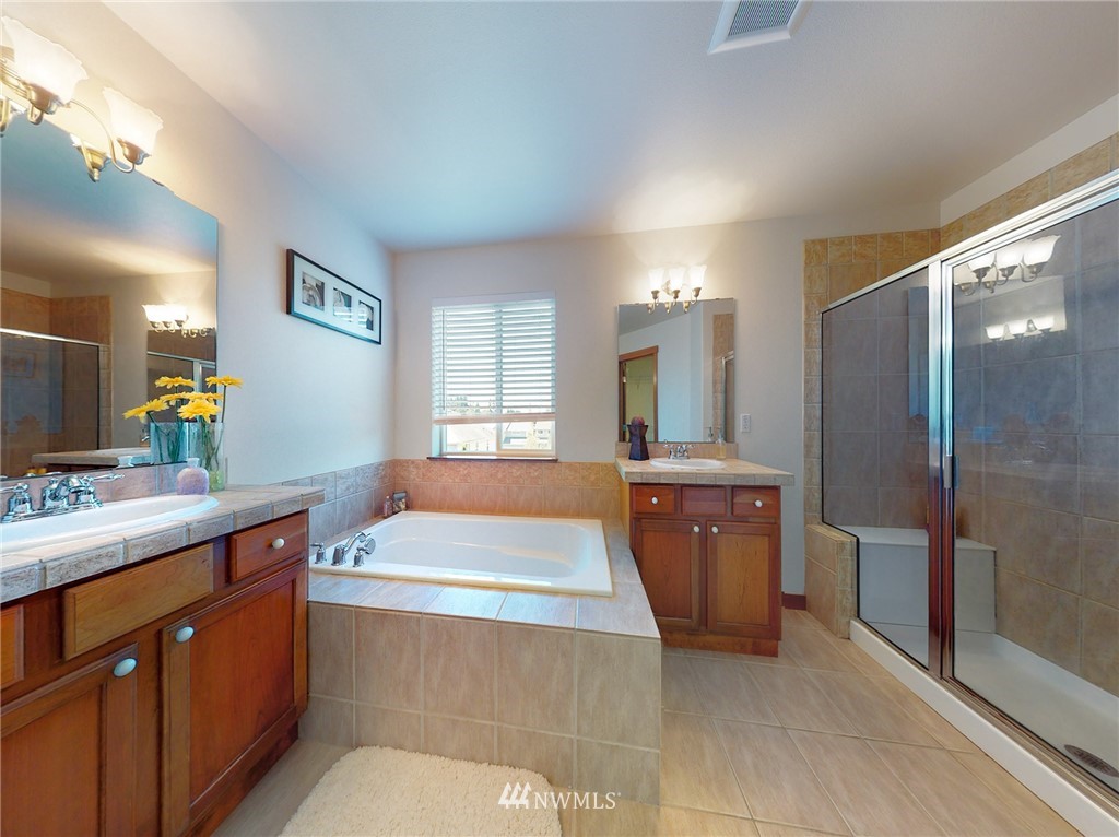 4002 216th Place Southeast Bothell, WA 98021 - Photo 19 of 28 a bathroom with a sink a vanity and mirror