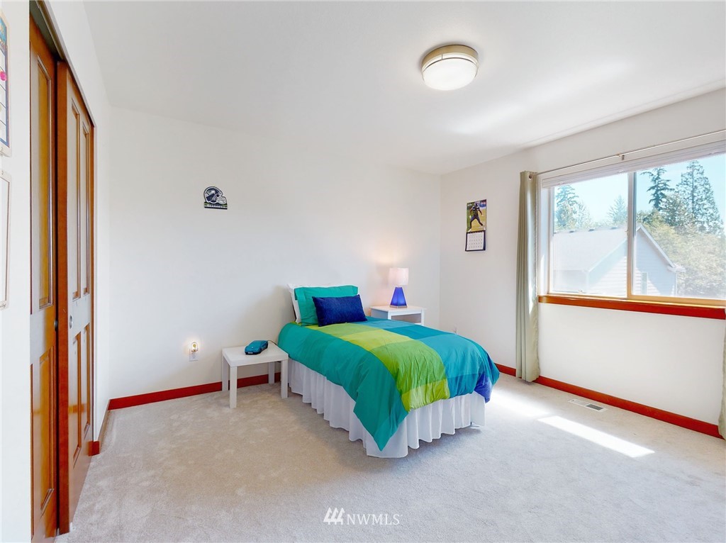 4002 216th Place Southeast Bothell, WA 98021 - Photo 23 of 28 a room with a bed and a large window