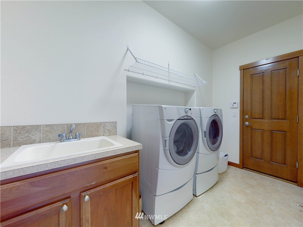 4002 216th Place Southeast Bothell, WA 98021 - Photo 26 of 28 a utility room with dryer and washer