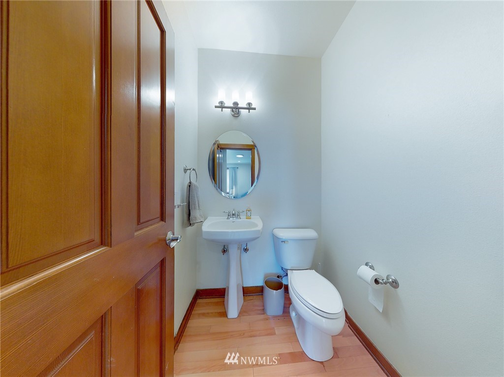 4002 216th Place Southeast Bothell, WA 98021 - Photo 27 of 28 a bathroom with a toilet a sink and mirror