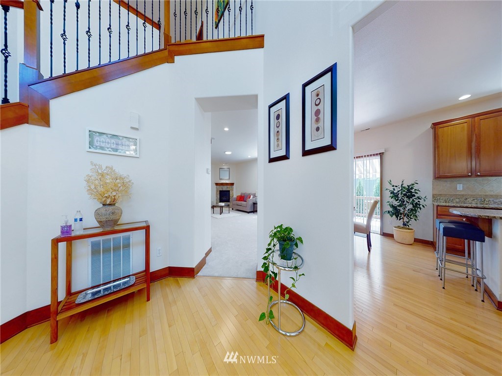 4002 216th Place Southeast Bothell, WA 98021 - Photo 9 of 28 a room with furniture and paintings on the wall