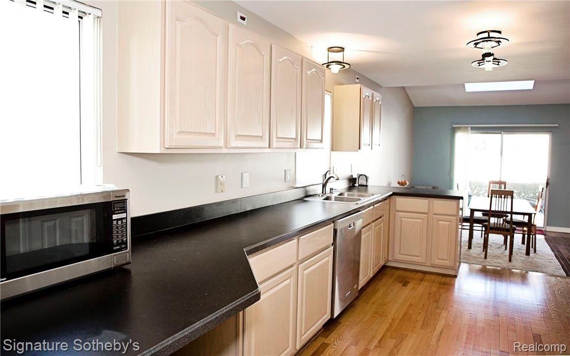 Spacious updated kitchen with hardwood flooring throughout