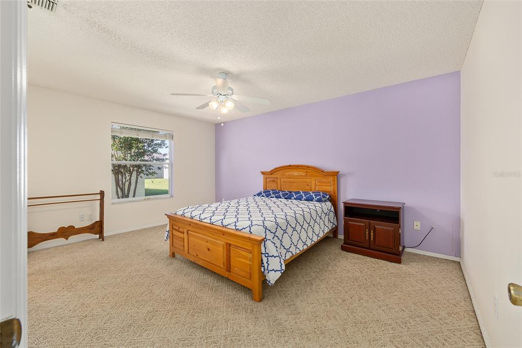 1710 Rosales Road The Villages, FL 32162 - Photo 10 of 23 a bedroom with a bed and a window