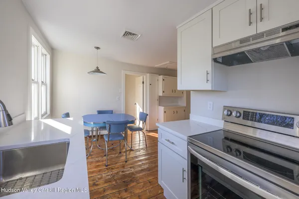 a kitchen with a stove and a microwave