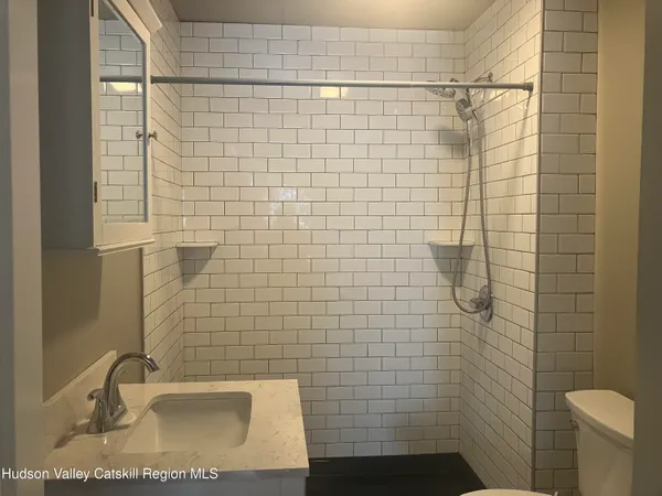 a bathroom with a sink a toilet