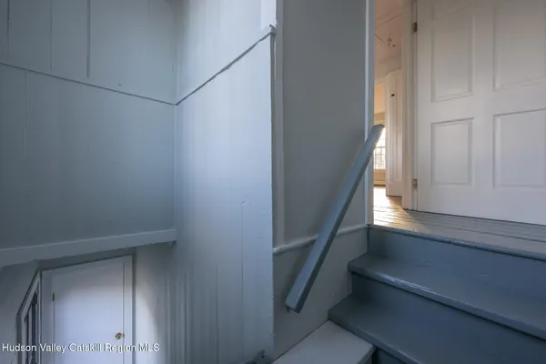 a view of entryway with wooden floor