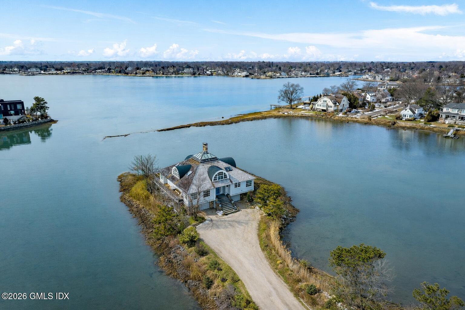 189 Shore Road Old Greenwich, CT 06870 - Photo 2 of 38 an aerial view of a residential building with outdoor space lake view and boat in the back