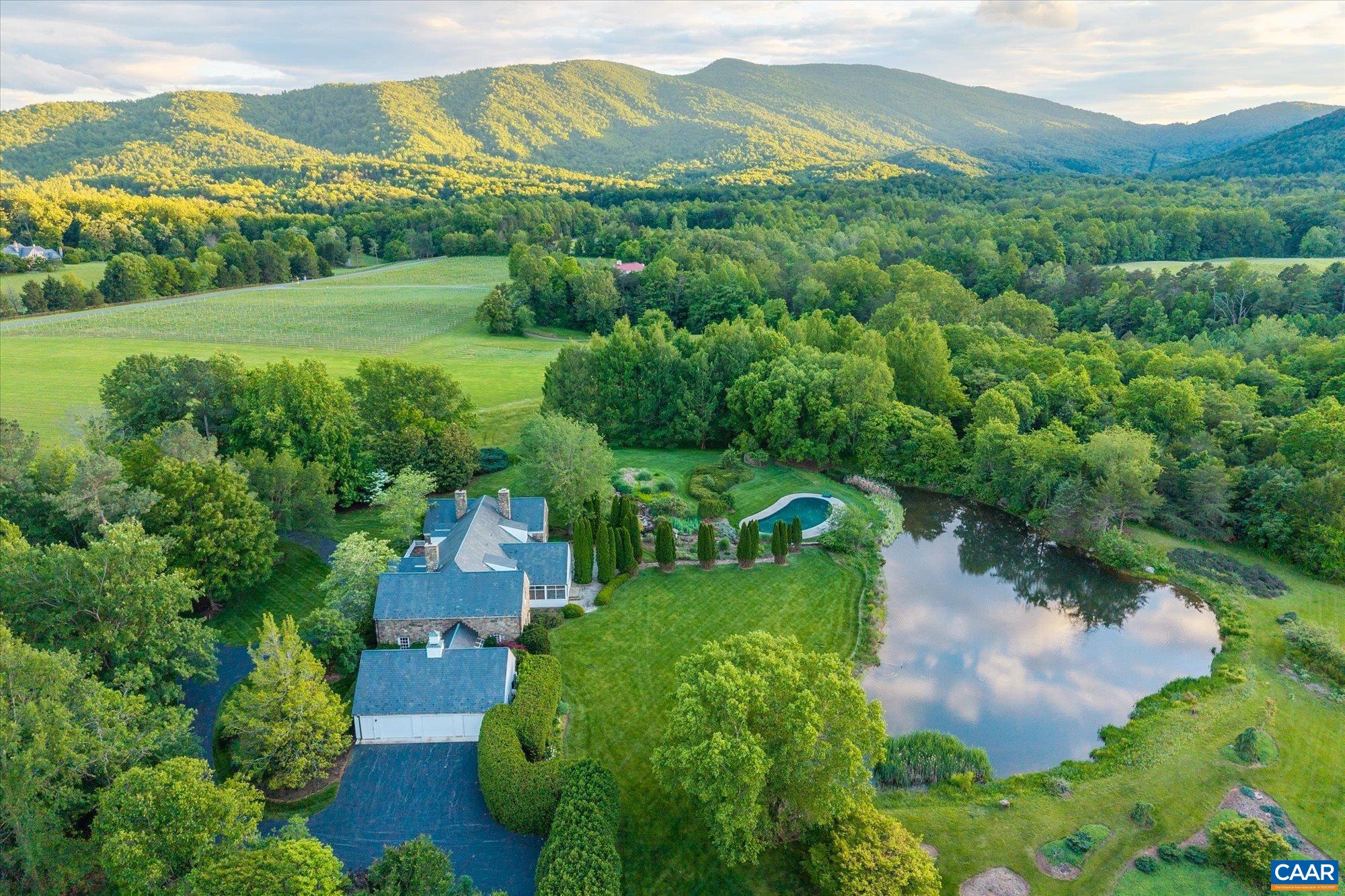 5190 Sugar Ridge Road Crozet, VA 22932 - Photo 69 of 69 an aerial view of green landscape with trees houses and mountain view