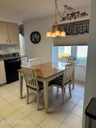 a kitchen with stainless steel appliances a stove a sink a counter space and cabinets