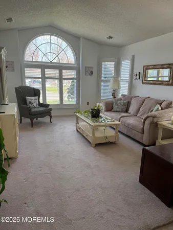 a view of a house with yard and porch