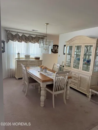 a table chair sitting in a kitchen next to a window