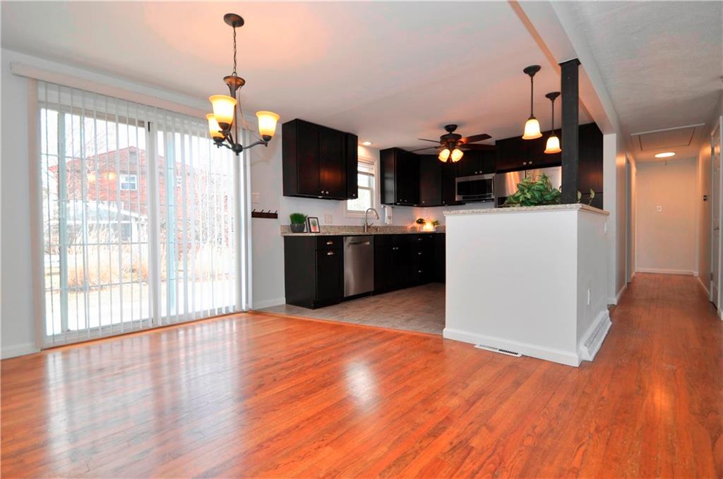 1313 Star Ridge Drive Pittsburgh, PA 15241 - Photo 10 of 36 a view of a kitchen kitchen island wooden floor and windows