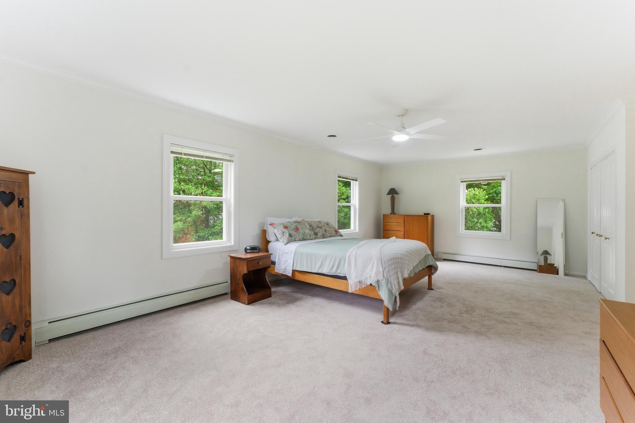 2100 Edgewater Parkway Silver Spring, MD 20903 - Photo 31 of 46 a spacious bedroom with a bed and a window