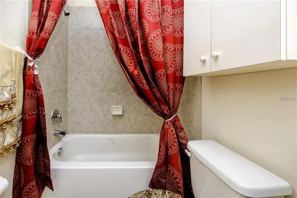 a bathroom with a sink a toilet and a bathtub