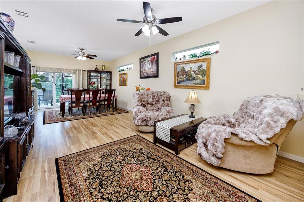 7820 Harbor Bridge Boulevard New Port Richey, FL 34654 - Photo 7 of 24 a living room with furniture and wooden floor