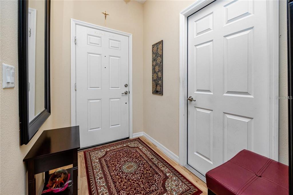 7820 Harbor Bridge Boulevard New Port Richey, FL 34654 - Photo 8 of 24 a view of room with walk in closet and wooden floor
