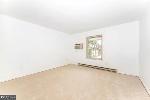 a bathroom with a sink a toilet and a large mirror