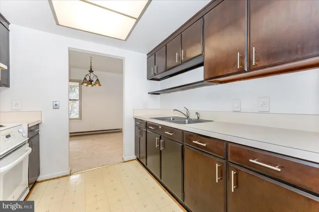 a kitchen with stainless steel appliances granite countertop a stove and a refrigerator