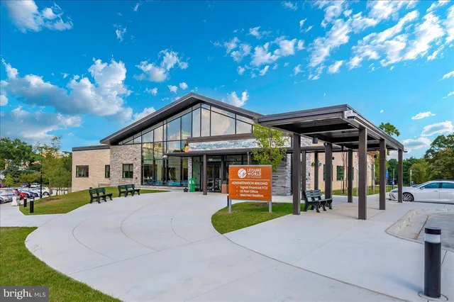 a room with wooden cabinets and stainless steel appliances