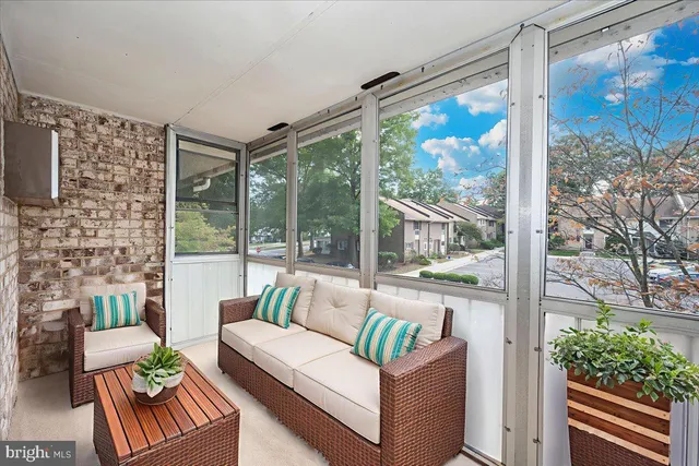 a bedroom with a bed and a potted plant