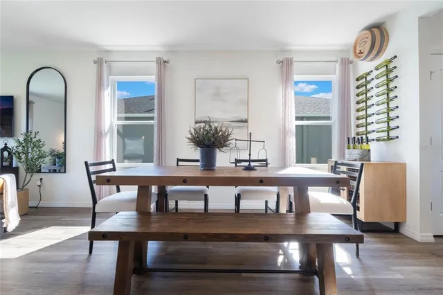 a view of a dining room with furniture and window