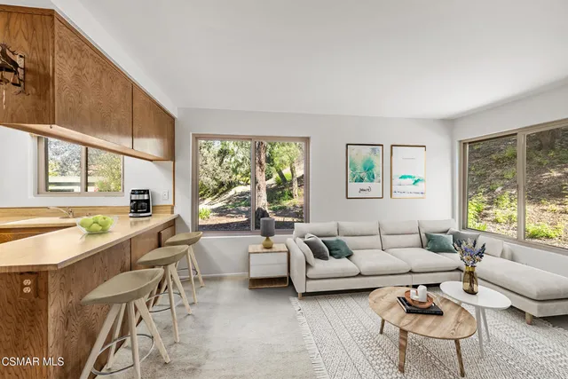 a view of empty room with fireplace and window