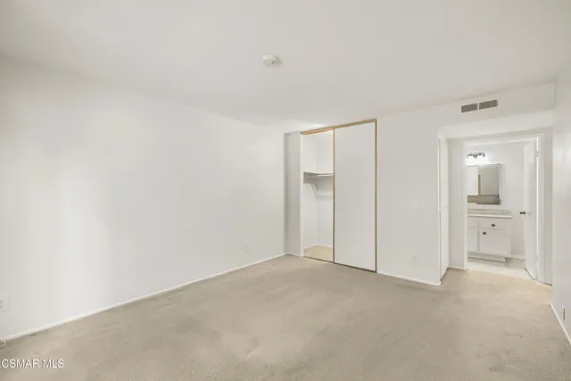 a bathroom with a granite countertop toilet a sink and a bathtub