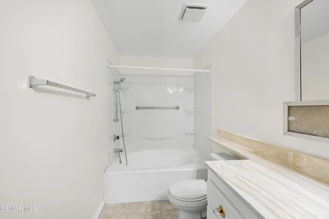 a view of a chairs and table in patio