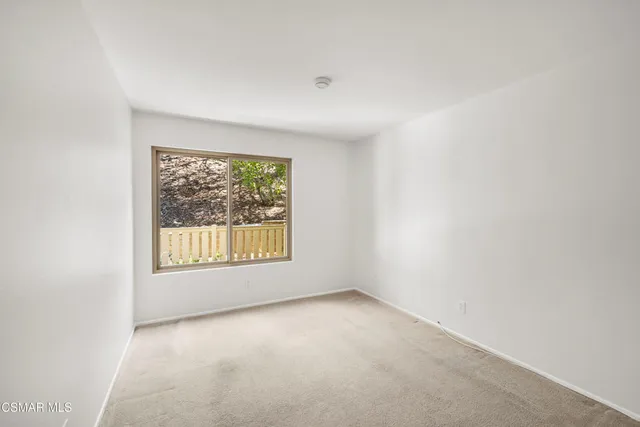 a view of balcony with wooden floor
