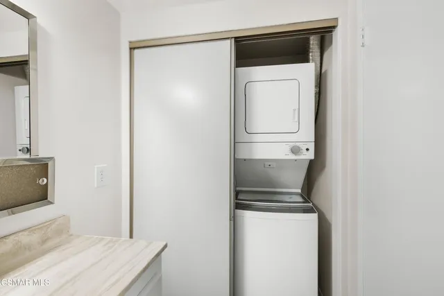 a view of a yard with wooden fence