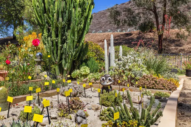 a living room with patio furniture and a window