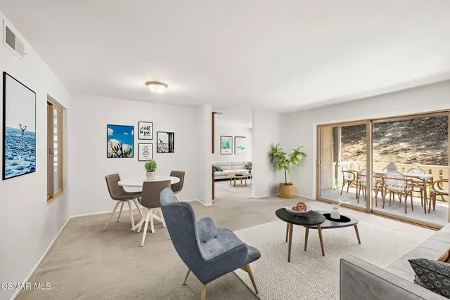 a view of a livingroom with wooden floor