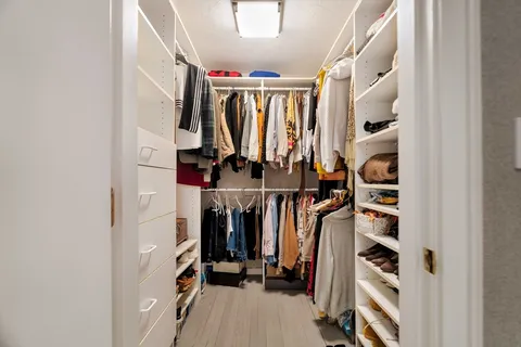 a bathroom with a sink mirror and a shower