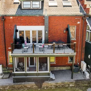 a view of a house with a yard and covered with snow