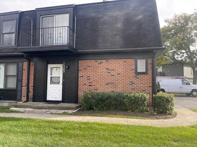 1302 Inverrary Lane, Unit 1302 Deerfield, IL 60015 - Photo 1 of 20 a view of a house with backyard and garden