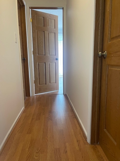 1302 Inverrary Lane, Unit 1302 Deerfield, IL 60015 - Photo 11 of 20 a view of a hallway with wooden floor
