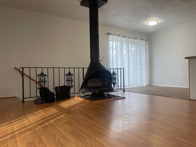 1302 Inverrary Lane, Unit 1302 Deerfield, IL 60015 - Photo 19 of 20 a living room with wooden floor