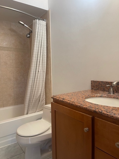 1302 Inverrary Lane, Unit 1302 Deerfield, IL 60015 - Photo 4 of 20 a bathroom with a granite countertop sink toilet and shower