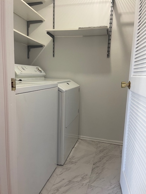 1302 Inverrary Lane, Unit 1302 Deerfield, IL 60015 - Photo 6 of 20 a utility room with dryer and washer