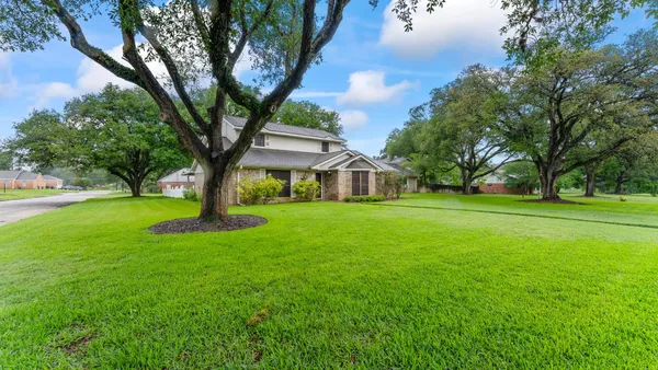 a house with garden in front of it