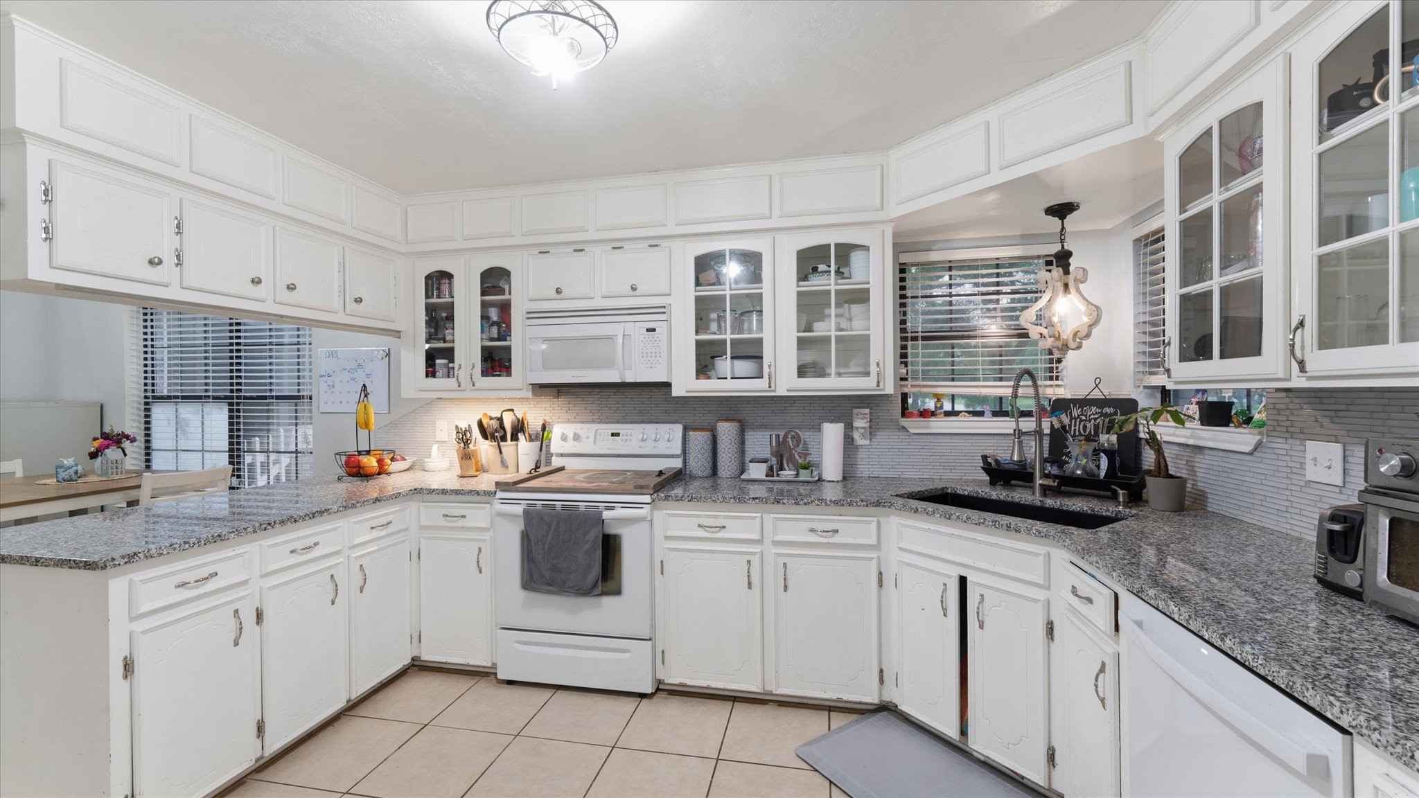 1645 9th Street Hempstead, TX 77445 - Photo 10 of 18 a kitchen with cabinets appliances a sink and a counter top space
