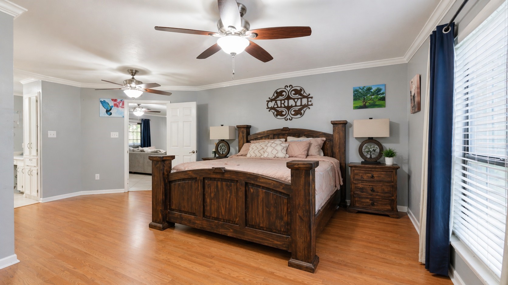 1645 9th Street Hempstead, TX 77445 - Photo 11 of 18 a bedroom with a bed and a chandelier