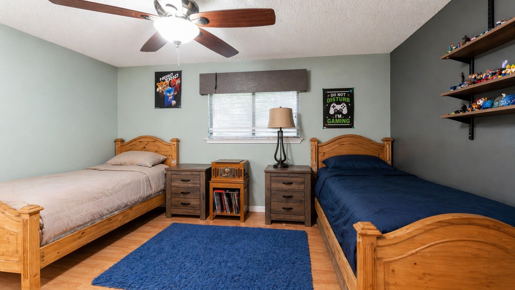 1645 9th Street Hempstead, TX 77445 - Photo 14 of 18 a bedroom with a bed and a chandelier
