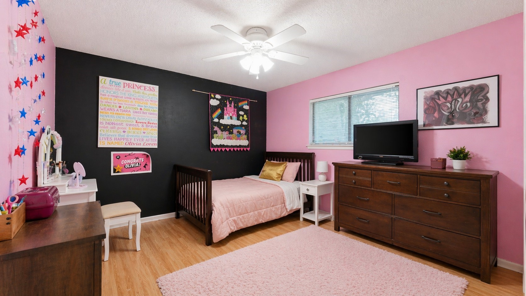 1645 9th Street Hempstead, TX 77445 - Photo 15 of 18 a bedroom with a bed and a flat screen tv