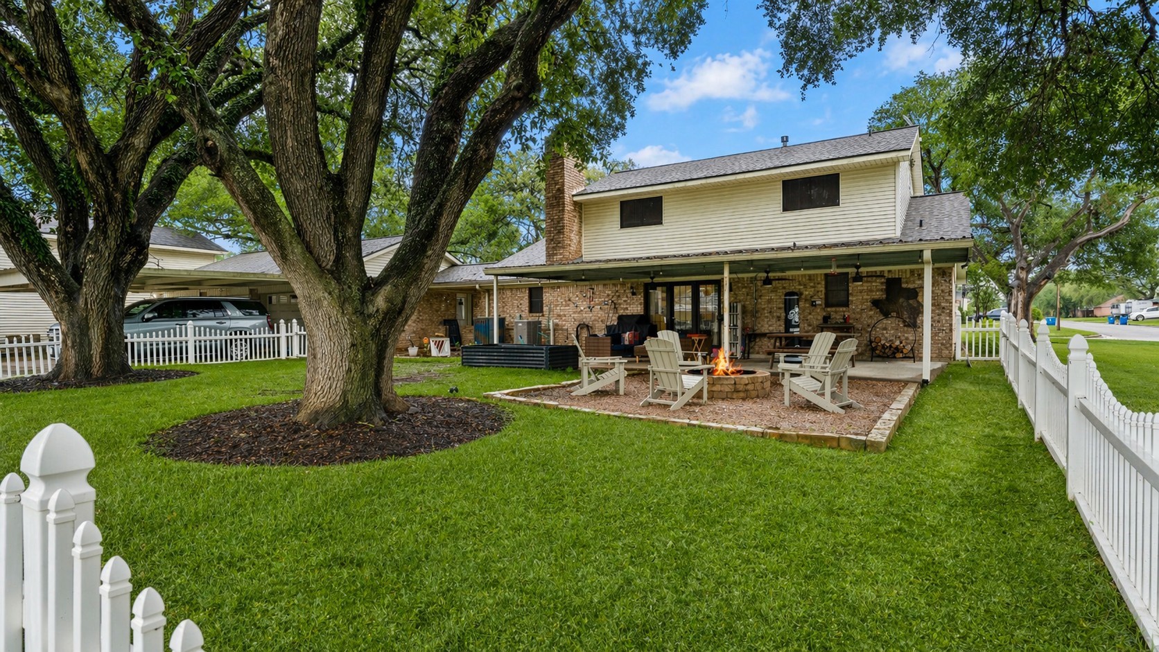 1645 9th Street Hempstead, TX 77445 - Photo 2 of 18 a front view of a house with garden and trees